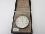 a clock that is in a box on a table