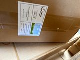 a box with a label on it sitting on the floor