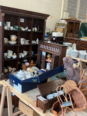 a table with a lot of items on it in a room