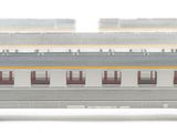 a white train car that is sitting on the tracks