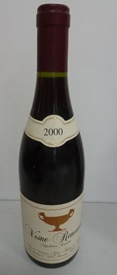 a bottle of wine that is sitting on a table