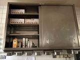 a large metal cabinet in the middle of a kitchen