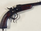 an old gun that is on display on a table