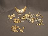 a lot of gold and silver coins on a table