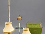 three lamps and a table with a lamp shade on it