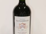 a bottle of wine that is sitting on a table