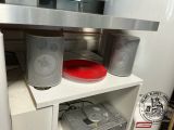 a shelf with speakers and a cd player on it