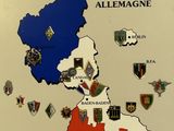 a map of france with all of the flags and emblems on it