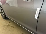 a close up of a car with a sticker on it