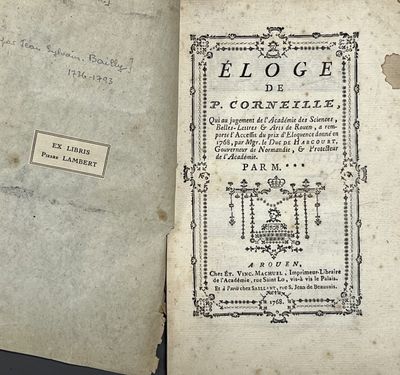 an old book that is open on a table