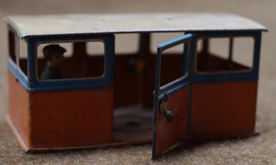 a small toy bus that is sitting on the ground