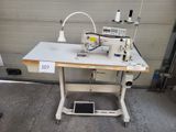 an image of a sewing machine sitting on top of a table