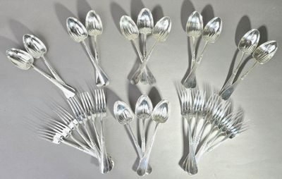 a lot of silver spoons and forks on the table