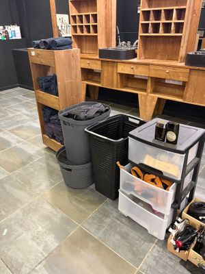 a room with a lot of bottles and bins on the floor