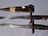 three different types of knives that are on a table