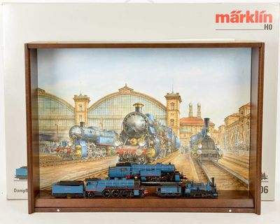 a picture of a train on display in a wooden frame