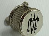 a ring with musical notes on it sitting on a table