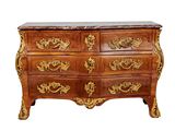 a large chest of drawers with a marble top