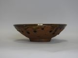 an image of a brown bowl sitting on top of a white table