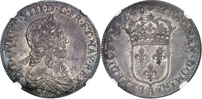 une pièce d'argent surmontée d'une couronne