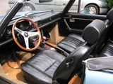 an image of a car with leather seats and a steering wheel