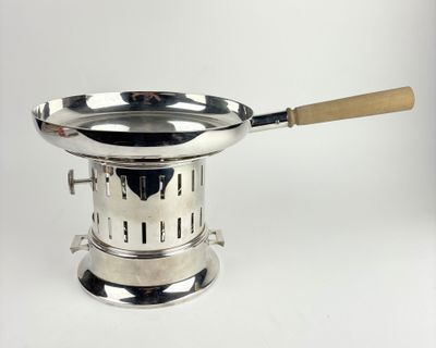 an image of a silver plate with a wooden handle on a white background