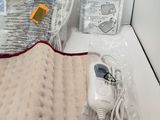 a heating pad with a heater and other items on the table