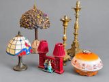 three different lamps and a lamp shade on a table