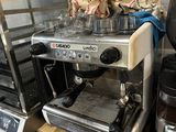 a coffee maker and a coffee maker on a shelf