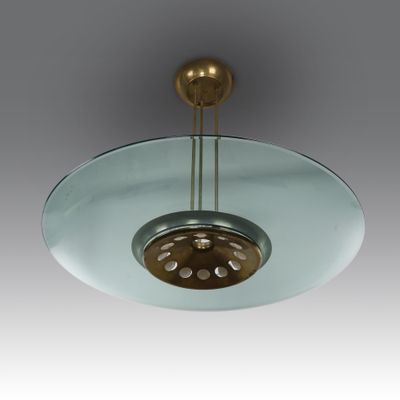 a close up of a glass ceiling light with a metal fixture