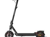 an image of a black scooter with wheels on a white background