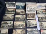 several old black and white photographs of buildings and buildings on a table