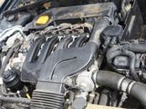 a picture of a car engine with its hood open