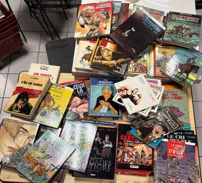 a lot of books on a table in a room