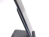 a cell phone that is sitting on top of a stand