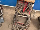 a lot of welding equipment that is sitting on the ground