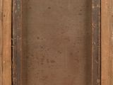 an old wooden picture frame with a small window in the middle