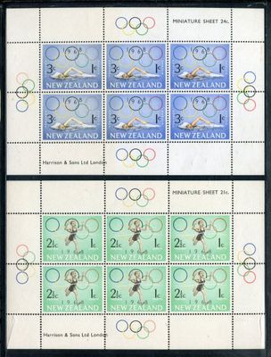 four stamps with olympic symbols on them are displayed in a black frame