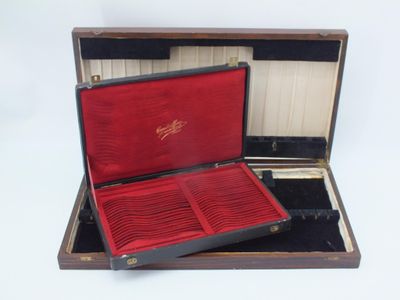 an open suitcase with a red lining on the inside of it