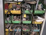 a pile of assorted tools and tools in a garage