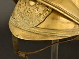 a gold helmet with a crown on top of it