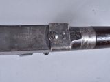 a close up of a gun that is on a table