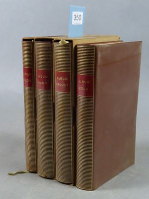three books are stacked on top of each other on a table