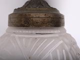 a glass jar with a metal lid on a table