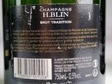 a bottle of champagne with a label on it that says champagne h blin