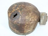 a rusted metal object with a hole in it