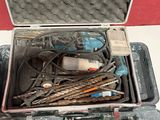 a case with tools in it sitting on a table