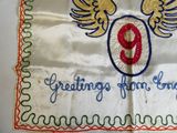 a white table cloth with a red and blue number 9 on it