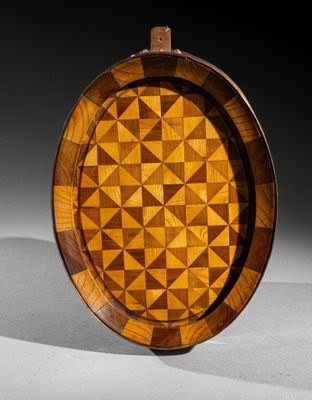 an image of a wooden plate with a geometric design on it