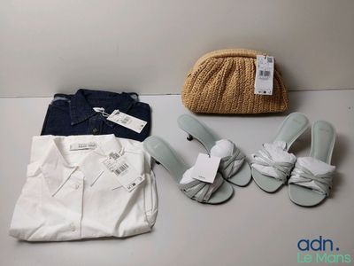 a bag, shoes, and a purse sitting on a table